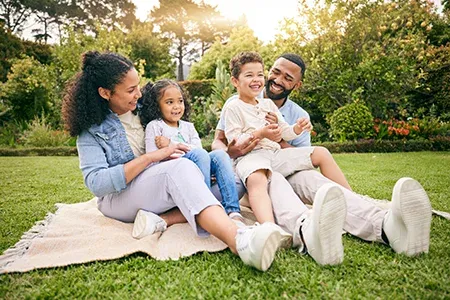 family enjoying back yard of home